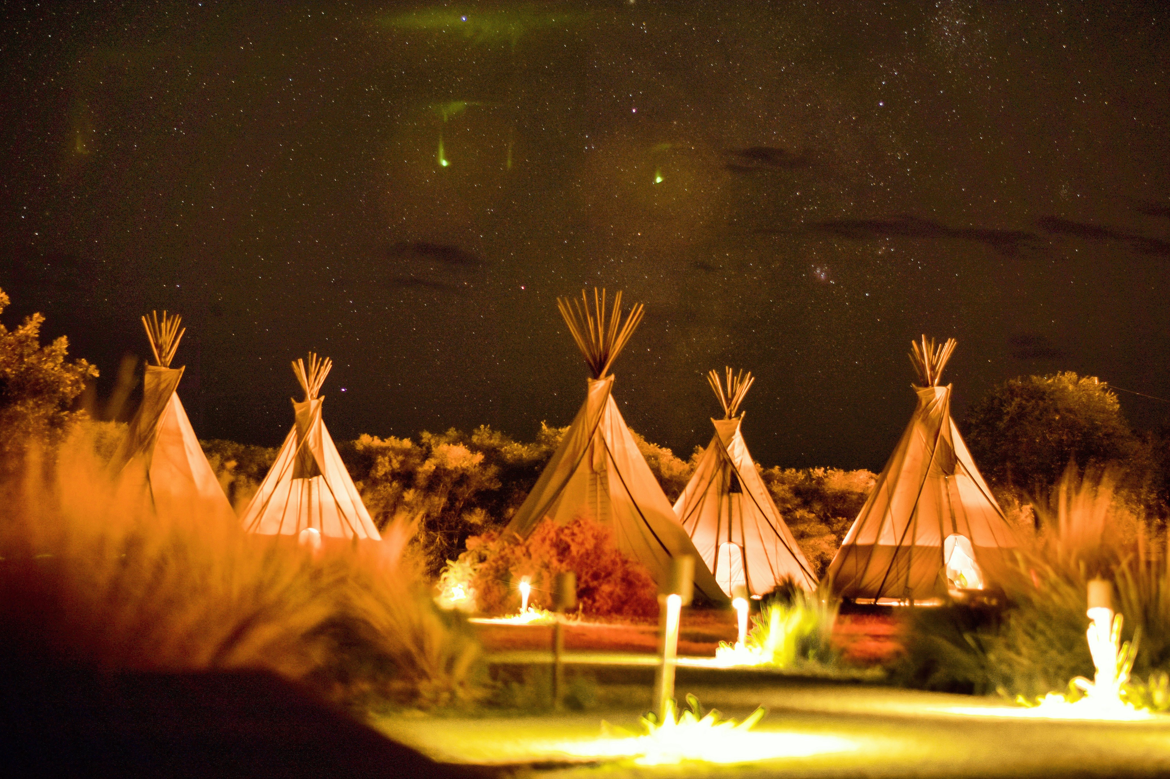 photography of tipi tents